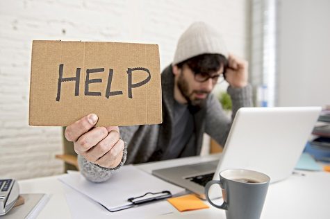 tired hispanic hipster businessman asking for help suffering work stress NYC guarantor
