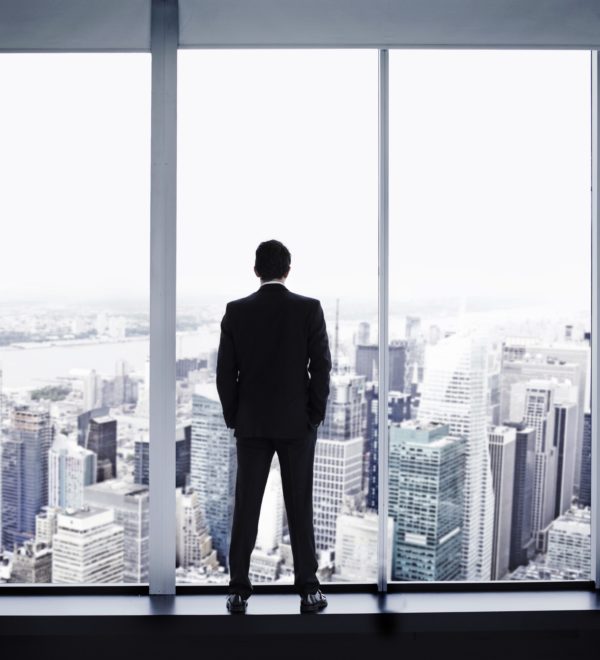 Young man looking out at Manhattan skyline